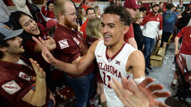 Oklahoma Sooners guard Trae Young (11) is greeted by fans after defeating the Kansas State Wildcats at Lloyd Noble Center.
