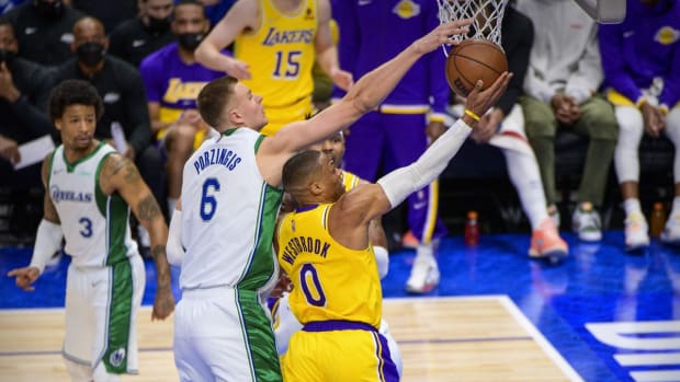 Dec 15, 2021; Dallas, Texas, USA; Dallas Mavericks center Kristaps Porzingis (6) blocks a shot by Los Angeles Lakers guard Russell Westbrook (0) during the first half at the American Airlines Center. Mandatory Credit: Jerome Miron-USA TODAY Sports