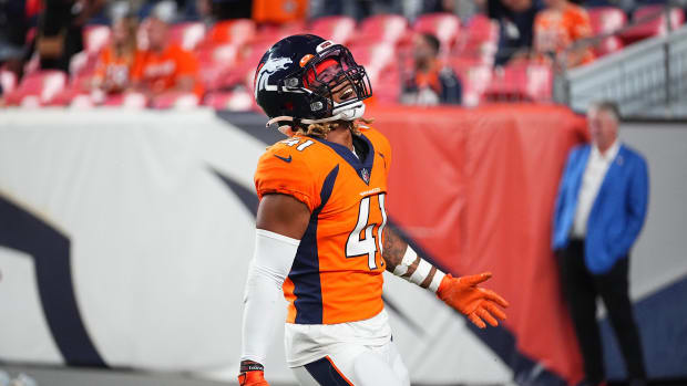 Denver Broncos safety Jamar Johnson (41) celebrates after defeating the Los Angeles Rams following a preseason game at Empower Field at Mile High.