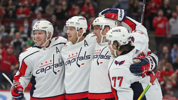 Dec 15, 2021; Chicago, Illinois, USA; Washington Capitals left wing Alex Ovechkin (2nd from right) celebrates scoring a goal during the second period against the Chicago Blackhawks at the United Center. Mandatory Credit: Dennis Wierzbicki-USA TODAY Sports