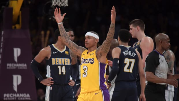 Lakers guard Isaiah Thomas celebrates vs. the Nuggets.