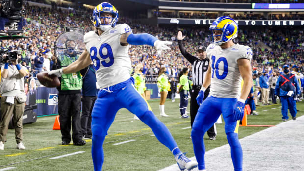 Los Angeles Rams tight end Tyler Higbee (89) celebrates with wide receiver Cooper Kupp (10) after catching a touchdown pass against the Seattle Seahawks during the third quarter at Lumen Field.