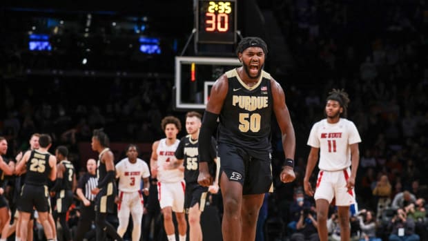 Dec 12, 2021; Brooklyn, New York, USA; Purdue Boilermakers forward Trevion Williams (50) reacts after making a basket during overtime against the North Carolina State Wolfpack at Barclays Center. Mandatory Credit: Vincent Carchietta-USA TODAY Sports