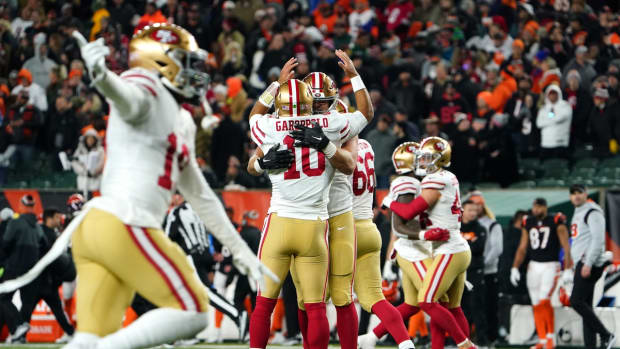 San Francisco 49ers quarterback Jimmy Garoppolo (10) and the team celebrate the win after an official review of the game-winning touchdown in the overtime period of a Week 14 NFL football game against the Cincinnati Bengals, Sunday, Dec. 12, 2021, Paul Brown Stadium in Cincinnati. The San Francisco 49ers defeated the Cincinnati Bengals, 26-23.

San Francisco 49ers At Cincinnati Bengals Dec 12