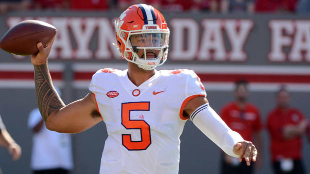 Sep 25, 2021; Raleigh, North Carolina, USA; Clemson Tigers quarterback DJ Uiagalelei (5) throws a pass during the first half against the North Carolina State Wolfpack at Carter-Finley Stadium.
