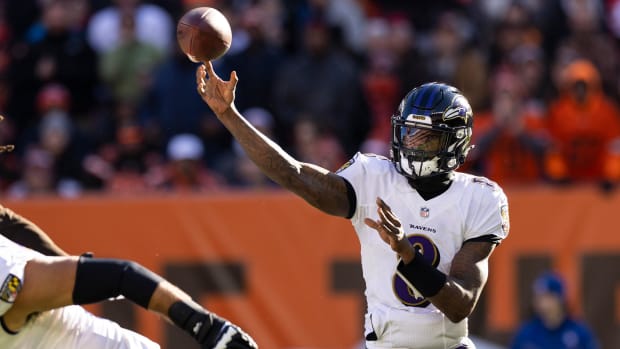Dec 12, 2021; Cleveland, Ohio, USA; Baltimore Ravens quarterback Lamar Jackson (8) throws the ball against the Cleveland Browns during the first quarter at FirstEnergy Stadium.