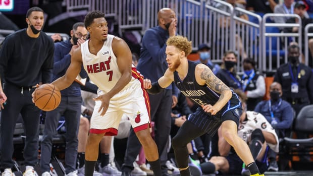 Dec 17, 2021; Orlando, Florida, USA; Orlando Magic guard Hassani Gravett (12) guards Miami Heat guard Kyle Lowry (7) during the second half at Amway Center. Mandatory Credit: Mike Watters-USA TODAY Sports
