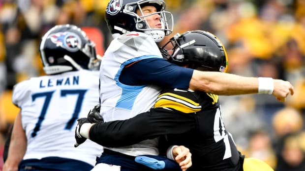 Tennessee Titans quarterback Ryan Tannehill (17) is hit after he throws by Pittsburgh Steelers inside linebacker Joe Schobert (93) during the second quarter at Heinz Field Sunday, Dec. 19, 2021 in Pittsburgh, Pa.

Titans Steelers 073