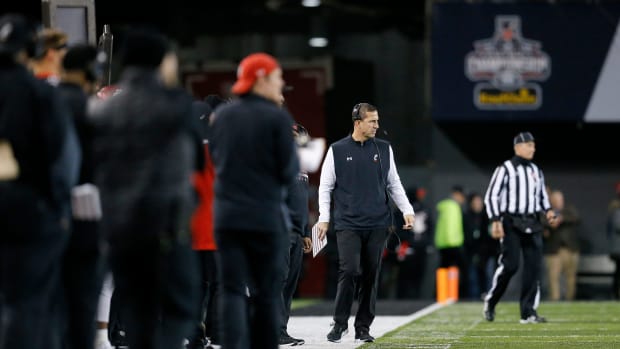 Cincinnati Bearcats head coach Luke Fickell walks the sideline in the fourth quarter of the American Athletic Conference Championship football game between the Cincinnati Bearcats and the Houston Cougars at Nippert Stadium in Cincinnati on Saturday, Dec. 4, 2021. The Bearcats remained unbeaten as they won the AAC Championship with a 35-20. Houston Cougars At Cincinnati Bearcats American Athletic Conference Championship