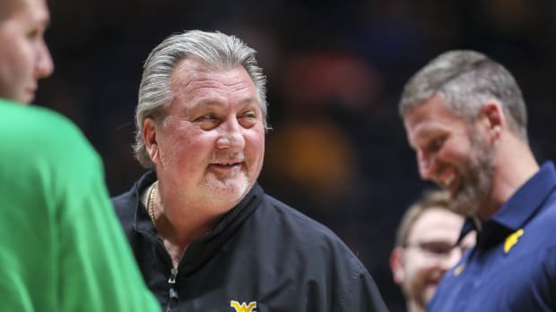 Dec 22, 2021; Morgantown, West Virginia, USA; West Virginia Mountaineers head coach Bob Huggins smiles after a conversation with an official during the first half against the Youngstown State Penguins at WVU Coliseum.