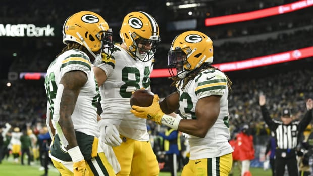 Dec 19, 2021; Baltimore, Maryland, USA; Green Bay Packers running back Aaron Jones (33) celebrates with teammates after scoring a touchdown during the second half against the Baltimore Ravens at M&amp;T Bank Stadium. Mandatory Credit: Tommy Gilligan-USA TODAY Sports