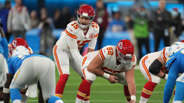 Dec 16, 2021; Inglewood, California, USA; Kansas City Chiefs quarterback Patrick Mahomes (15) prepares to take the snap from center Creed Humphrey (52) in the first half against the Los Angeles Chargers at SoFi Stadium. Mandatory Credit: Kirby Lee-USA TODAY Sports