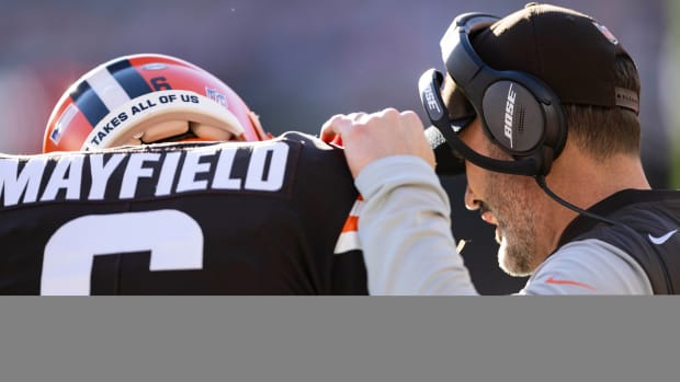 Cleveland Browns head coach Kevin Stefanski talks with quarterback Baker Mayfield (6) during the first quarter against the Baltimore Ravens at FirstEnergy Stadium.
