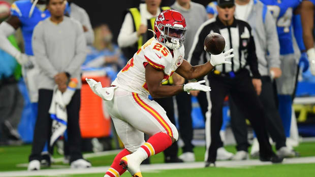 Dec 16, 2021; Inglewood, California, USA; Kansas City Chiefs running back Clyde Edwards-Helaire (25) catches a pass against the Los Angeles Chargers during the first half at SoFi Stadium. Mandatory Credit: Gary A. Vasquez-USA TODAY Sports