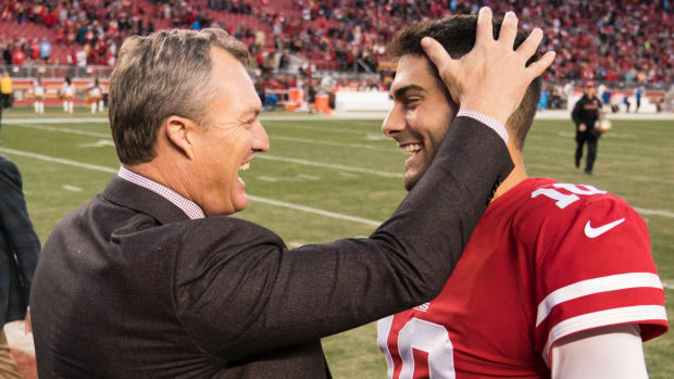 San Francisco 49ers general manager John Lynch (left) celebrates with quarterback Jimmy Garoppolo (10) after a win in 2017.