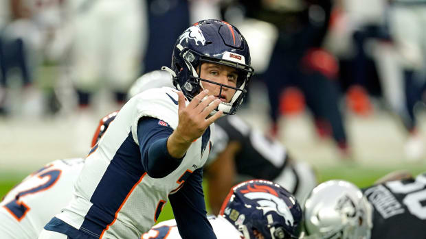 Denver Broncos quarterback Drew Lock (3) yells out from the line of scrimmage against the Las Vegas Raiders during the first half at Allegiant Stadium.