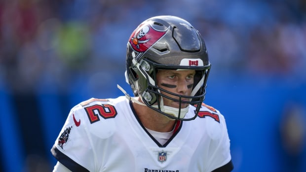 Dec 26, 2021; Charlotte, North Carolina, USA; Tampa Bay Buccaneers quarterback Tom Brady (12) reacts after a touchdown against the Carolina Panthers during the first quarter at Bank of America Stadium. Mandatory Credit: Jim Dedmon-USA TODAY Sports