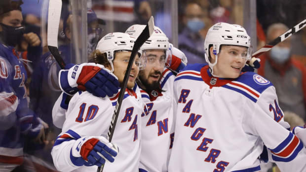 Dec 29, 2021; Sunrise, Florida, USA; New York Rangers center Mika Zibanejad (93) celebrates with left wing Artemi Panarin (10) and right wing Kaapo Kakko (24) after scoring against the Florida Panthers during the second period at FLA Live Arena. Mandatory Credit: Sam Navarro-USA TODAY Sports