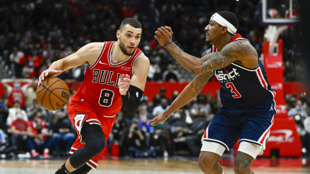 Jan 1, 2022; Washington, District of Columbia, USA; Chicago Bulls guard Zach LaVine (8) dribbles as Washington Wizards guard Bradley Beal (3) defends during the second half at Capital One Arena. Mandatory Credit: Brad Mills-USA TODAY Sports
