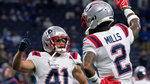 Myles Bryant and Patriots teammate Jalen Mills share a celebratory moment.