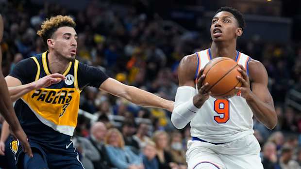 New York Knicks' RJ Barrett (9) is defended by Indiana Pacers' Chris Duarte (3) during the first half of an NBA basketball game Wednesday, Dec. 8, 2021, in Indianapolis.