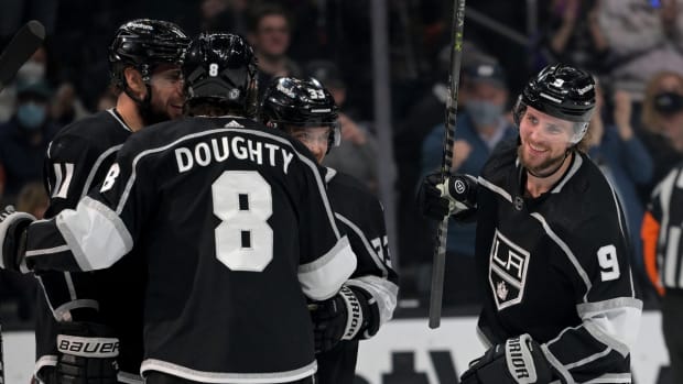 Jan 1, 2022; Los Angeles, California, USA; Los Angeles Kings celebrate after a goal by center Adrian Kempe (9) against the Philadelphia Flyers in the second period at Crypto.com Arena. Mandatory Credit: Jayne Kamin-Oncea-USA TODAY Sports