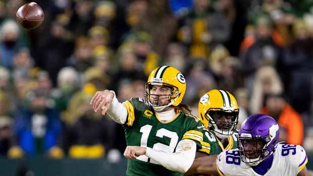 Jan 2, 2022; Green Bay, WI, USA; Green Bay Packers quarterback Aaron Rodgers (12) throws a pass in the third quarter against the Minnesota Vikings at Lambeau Field.