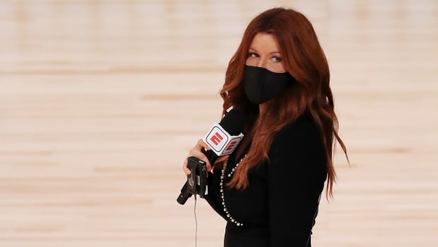 July 31, 2020; Lake Buena Vista, USA; ESPN reporter Rachel Nichols stands on the court before a game between the Houston Rockets and the Dallas Mavericks at The Arena at ESPN Wide World Of Sports Complex on July 31, 2020 in Lake Buena Vista, Florida.