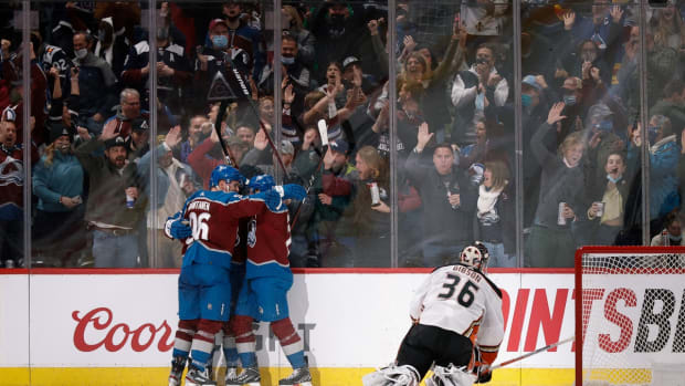 Jan 2, 2022; Denver, Colorado, USA; Colorado Avalanche right wing Mikko Rantanen (96) and center Nathan MacKinnon (29) celebrate the goal of right wing Logan O'Connor (25) as Anaheim Ducks goaltender John Gibson (36) looks on in the third period at Ball Arena. Mandatory Credit: Isaiah J. Downing-USA TODAY Sports