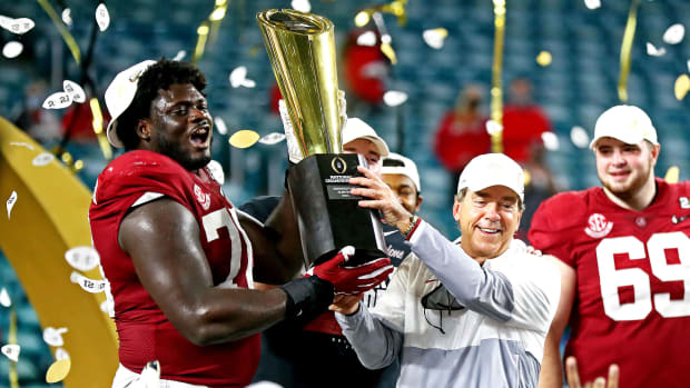 Alabama coach Nick Saban lifts the 2020 national championship trophy