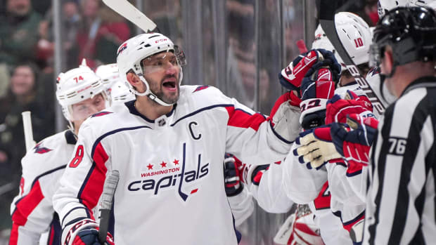 Jan 8, 2022; Saint Paul, Minnesota, USA; Washington Capitals left wing Alex Ovechkin (8) celebrates after goal by center Evgeny Kuznetsov (92) against the Minnesota Wild in the second period at Xcel Energy Center. Mandatory Credit: Brad Rempel-USA TODAY Sports