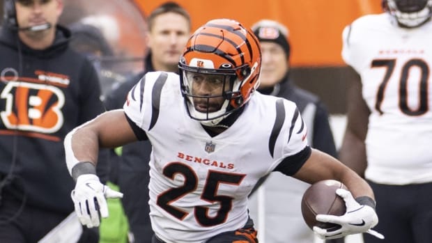 Jan 9, 2022; Cleveland, Ohio, USA; Cincinnati Bengals running back Chris Evans (25) runs the ball against the Cleveland Browns during the second quarter at FirstEnergy Stadium. Mandatory Credit: Scott Galvin-USA TODAY Sports