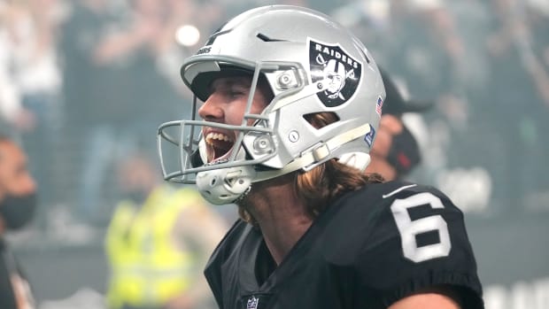 Raiders punter A.J. Cole celebrates after beating Chargers
