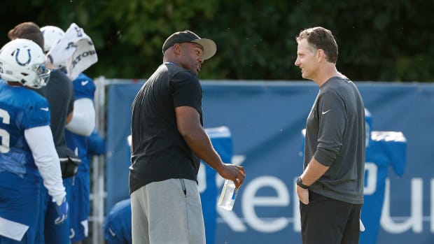 Former Indianapolis Colts defensive end Dwight Freeney talks to the Colts defensive coordinator Matt Eberflus following their preseason training camp practice at Grand Park in Westfield on Saturday, August 10, 2019. Colts Preseason Training Camp