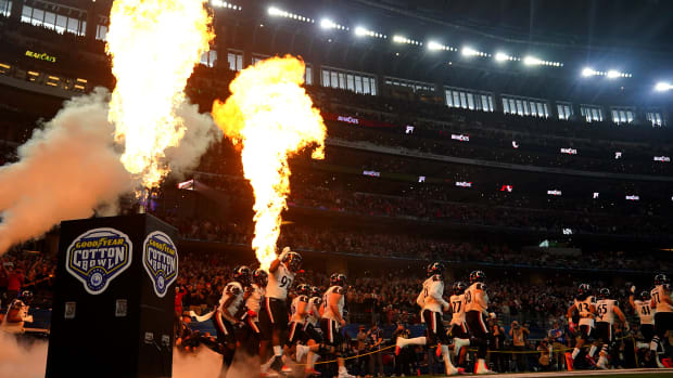 The Cincinnati Bearcats are introduced ahead of the College Football Playoff semifinal game against the Alabama Crimson Tide at the 86th Cotton Bowl Classic, Friday, Dec. 31, 2021, at AT&T Stadium in Arlington, Texas.