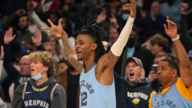 Memphis Grizzles guard Ja Morant (12) reacts after a basket during the second half against the Golden State Warriors at FedExForum.