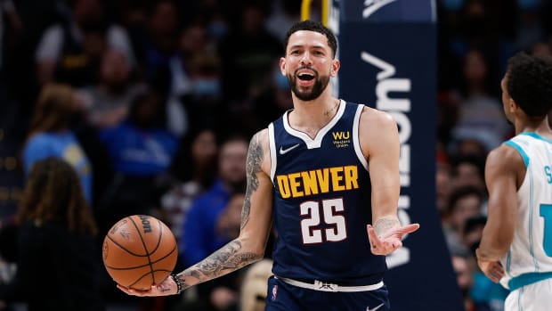 Dec 23, 2021; Denver, Colorado, USA; Denver Nuggets guard Austin Rivers (25) reacts after a play in the third quarter against the Charlotte Hornets at Ball Arena.