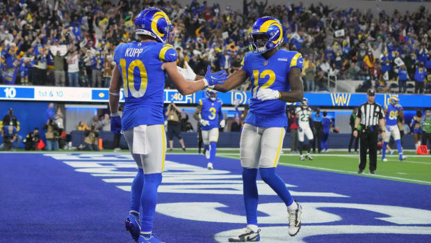 Dec 21, 2021; Inglewood, California, USA; Los Angeles Rams wide receiver Cooper Kupp (10) celebrates with wide receiver Van Jefferson (12) after scoring on a 29-yard touchdown reception against the Seattle Seahawks in the second half at SoFi Stadium. The Rams defeated the Seahawks 20-10. Mandatory Credit: Kirby Lee-USA TODAY Sports