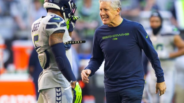 Pete Carroll chats with Quandre Diggs