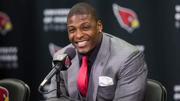 Adrian Wilson announces his retirement after signing a contract with the Cardinals at the Cardinals Training facility in Tempe on April 18, 2015.