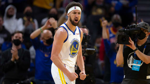 Golden State Warriors guard Klay Thompson celebrates his 1,800th career three-point basket during the third quarter against the Cleveland Cavaliers at Chase Center.