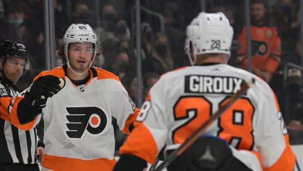 Jan 1, 2022; Los Angeles, California, USA; Philadelphia Flyers left wing Joel Farabee (86) celebrates with center Claude Giroux (28) after a goal against the Los Angeles Kings in the first period at Crypto.com Arena. Mandatory Credit: Jayne Kamin-Oncea-USA TODAY Sports