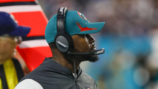 Jan 9, 2022; Miami Gardens, Florida, USA; Miami Dolphins head coach Brian Flores watches from the sideline during the second quarter against the New England Patriots at Hard Rock Stadium.
