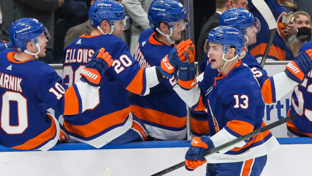 Jan 13, 2022; Elmont, New York, USA; New York Islanders center Mathew Barzal (13) celebrates after scoring a goal against New Jersey Devils during the third period at UBS Arena. Mandatory Credit: Tom Horak-USA TODAY Sports