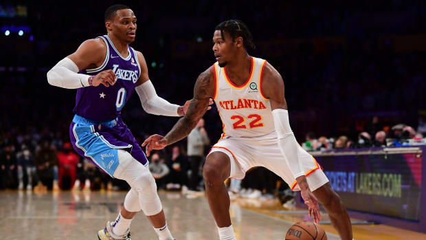 Atlanta Hawks forward Cam Reddish (22) moves the ball against Los Angeles Lakers guard Russell Westbrook (0) during the first half at Crypto.com Arena.