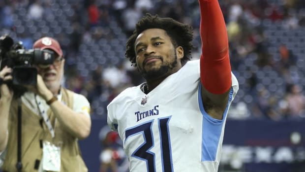 Tennessee Titans free safety Kevin Byard (31) wavies to the crowd after the game against the Houston Texans at NRG Stadium.