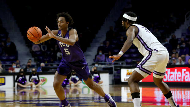 Jan 12, 2022; Manhattan, Kansas, USA; TCU Horned Frogs forward Chuck O Bannon Jr. (5) passes the ball away from Kansas State Wildcats guard Selton Miguel (3) during the second half at Bramlage Coliseum