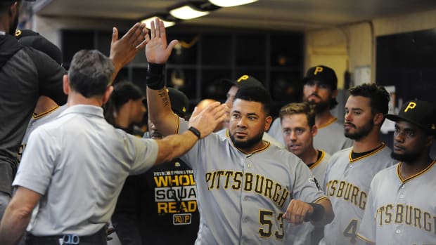 Sep 22, 2019; Milwaukee, WI, USA; Pittsburgh Pirates right fielder Melky Cabrera (53) receives high-fives in the dug out after scoring a run against the Milwaukee Brewers in the eighth inning at Miller Park.