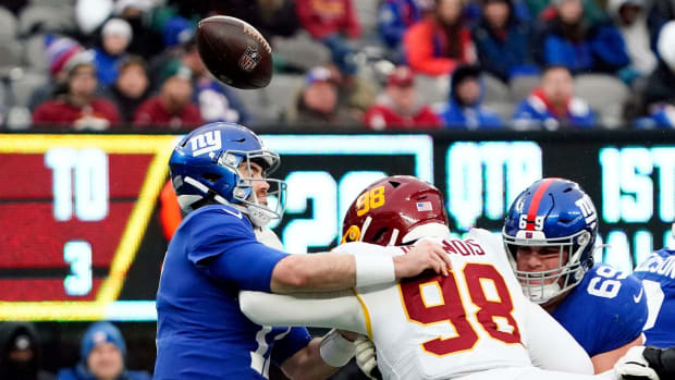 Washington Football Team defensive tackle Matt Ioannidis (98) forces New York Giants quarterback Jake Fromm (17) to fumble the ball in the second half. The Giants lose to Washington, 22-7, at MetLife Stadium on Sunday, Jan. 9, 2022.