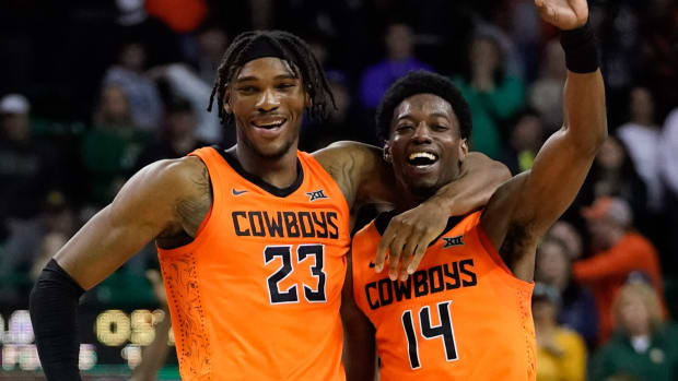Oklahoma State Cowboys guard Bryce Williams (14) celebrates with forward Tyreek Smith (23) following their victory over the Baylor Bears at Ferrell Center.